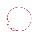 Red braided cord bracelet with a gold-tone T-bar clasp and knot near the clasp, close-up view