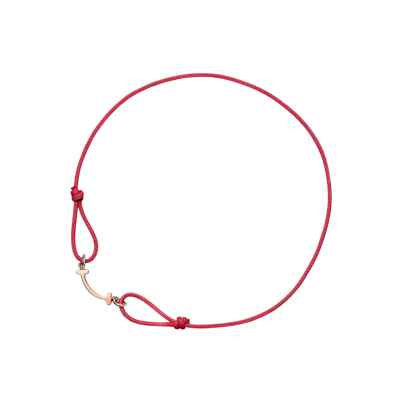 Red braided cord bracelet with a gold-tone T-bar clasp and knot near the clasp, close-up view