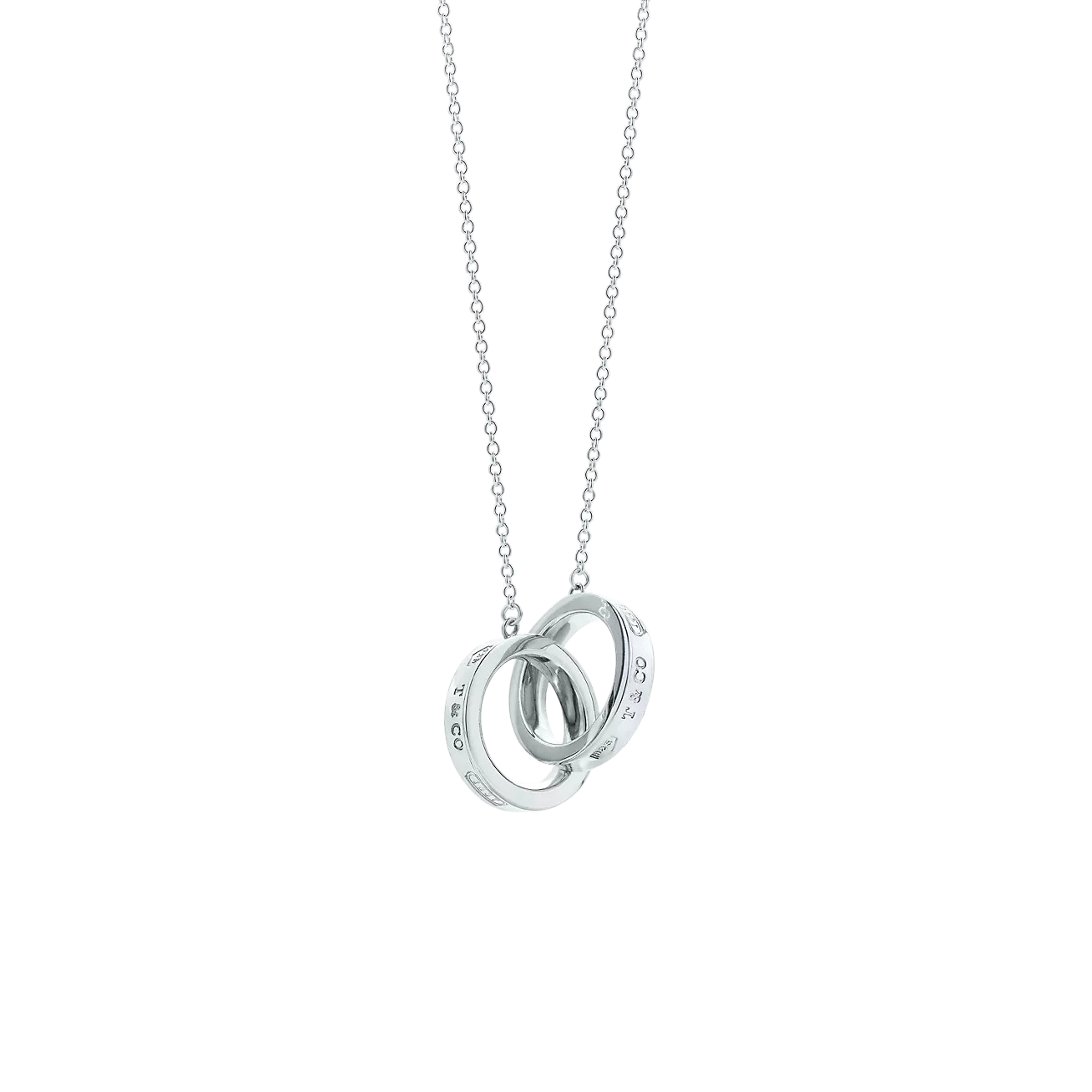 Silver necklace with an interlocking rings pendant hanging from a delicate chain.