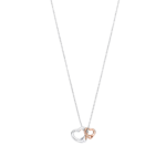 Two interlocking heart pendants, one silver and one rose gold, hanging from a silver chain.