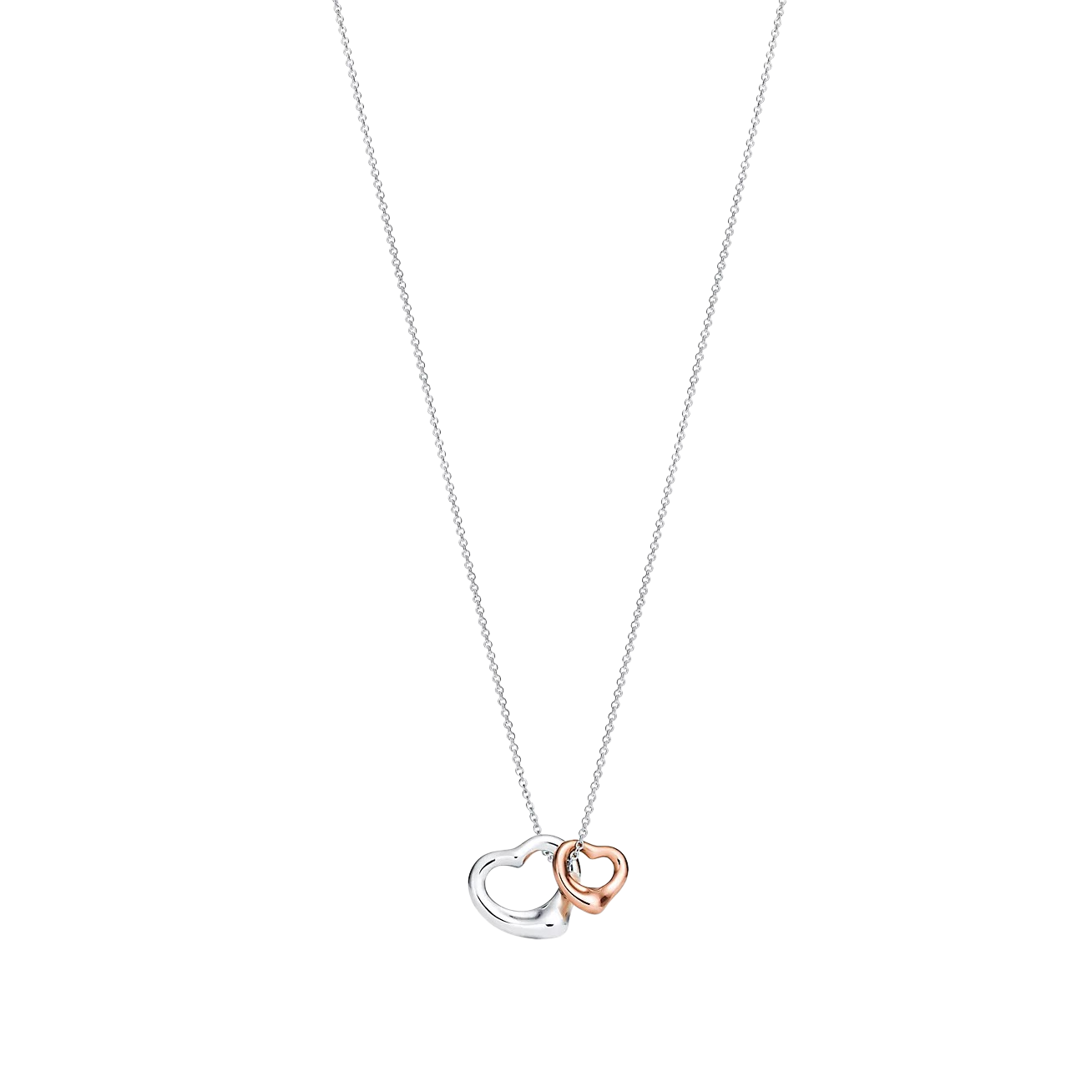 Two interlocking heart pendants, one silver and one rose gold, hanging from a silver chain.
