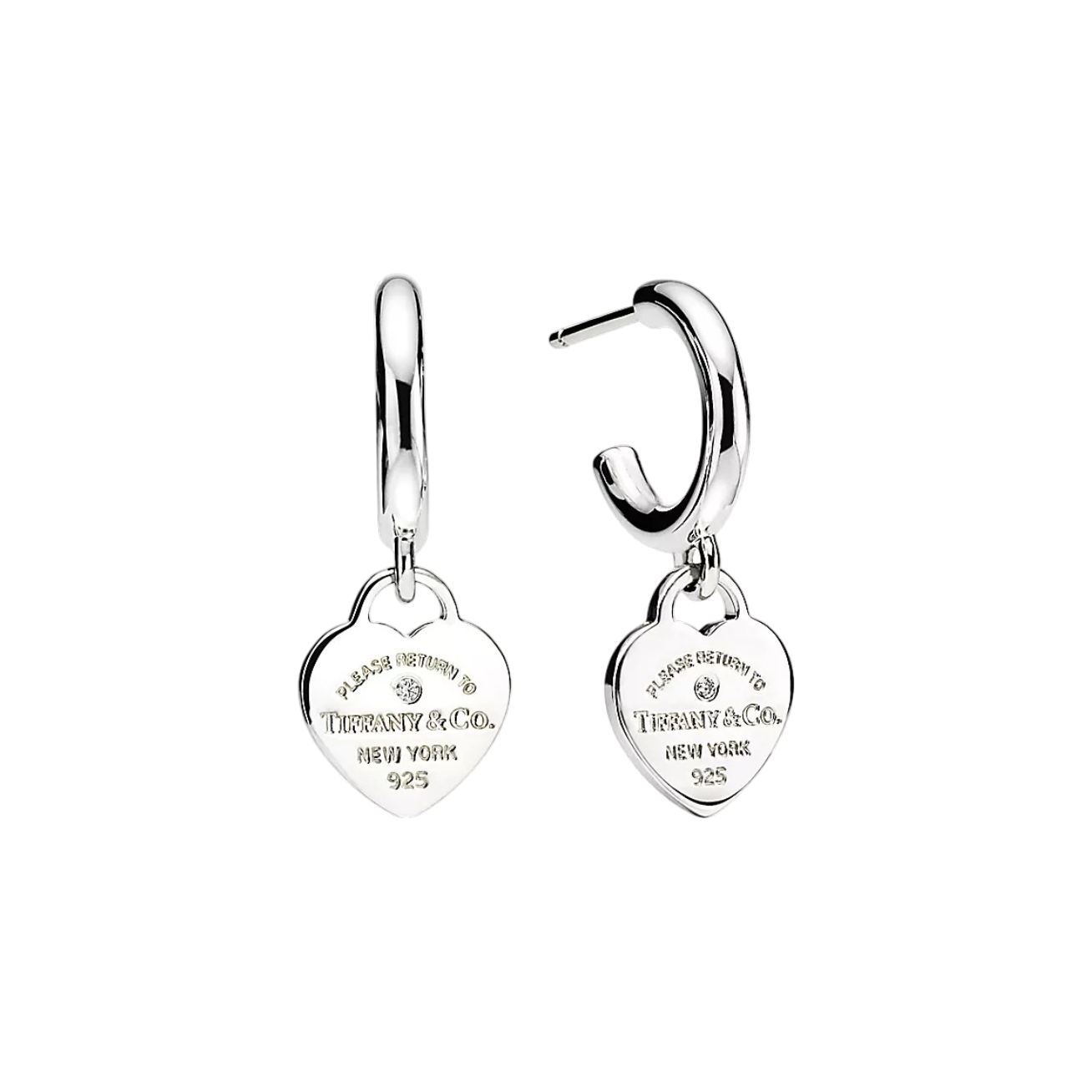 Two silver hoop earrings each with a heart charm engraved 'Please return to Tiffany & Co. New York 925' on a black background