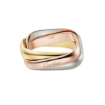 Intertwined tri-color gold rings (yellow, rose, and white gold) by Cartier.