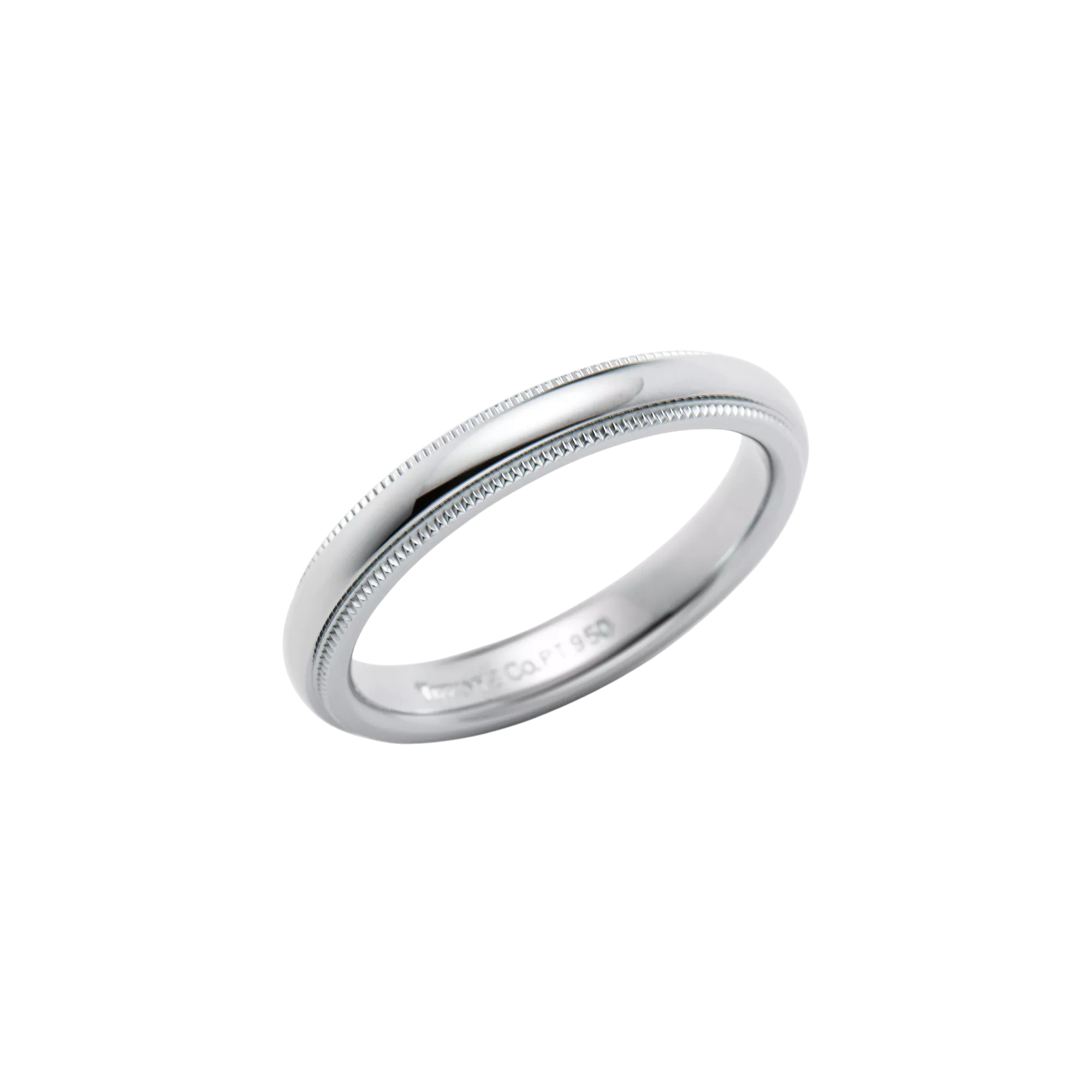 Close-up of a silver ring with a milgrain edge against a black background.