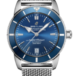 Breitling SuperOcean automatic wristwatch with a blue sunburst dial, stainless steel case and mesh bracelet, date window at 6 o'clock, 200m water resistance.