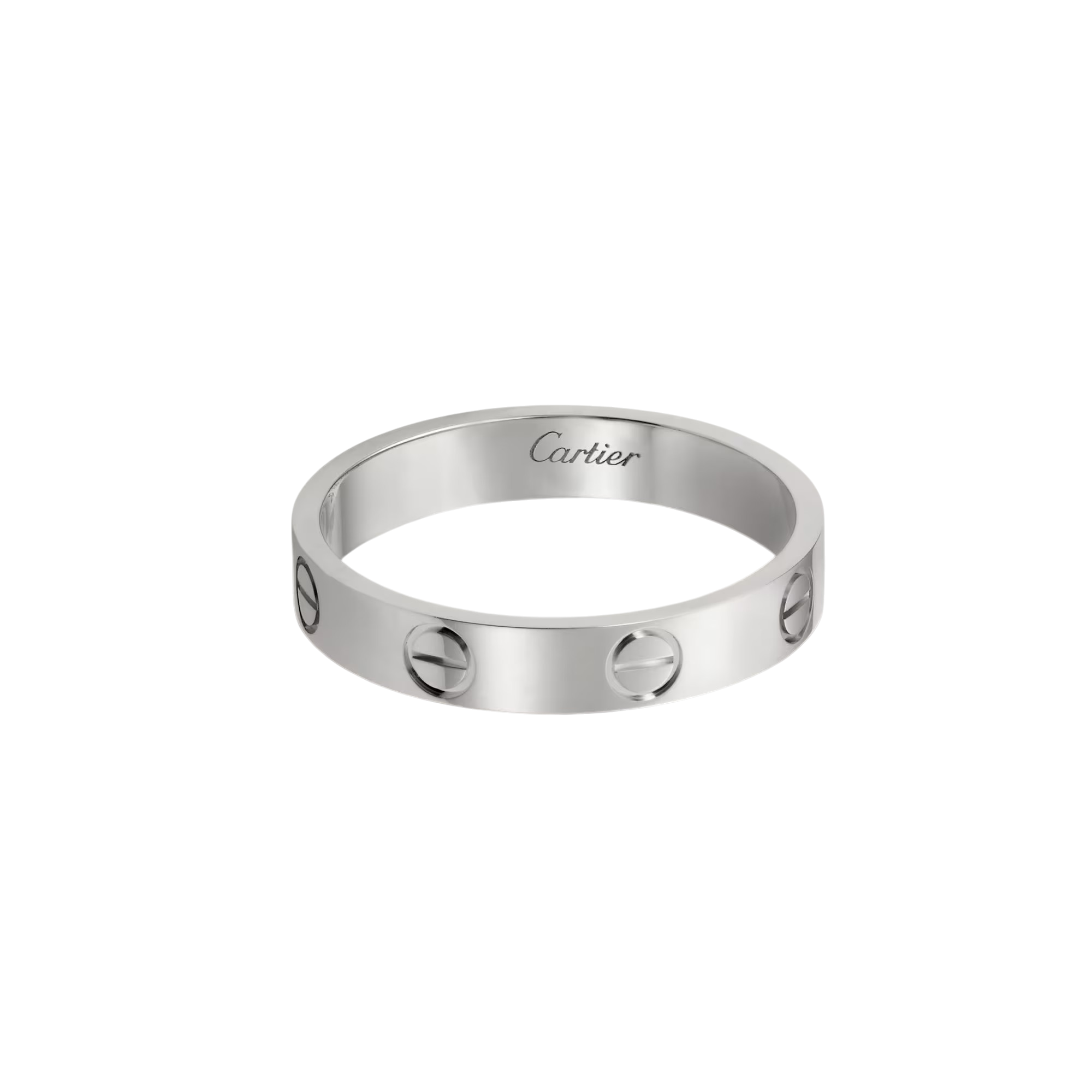 Close-up of a silver Cartier ring with a smooth band and circular cut-out accents, partially visible against a dark background, with 'Cartier' inscription on the inner edge.