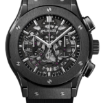 Hublot skeleton chronograph watch with a black brushed case, visible gears, and a rubber strap