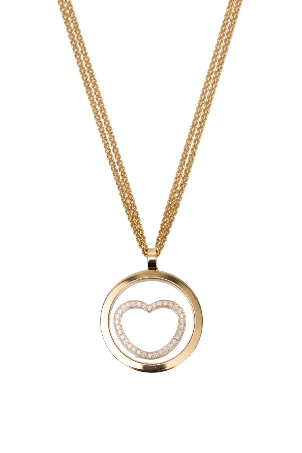 Gold circular pendant on a gold chain featuring a diamond-studded heart in the center against a black background.