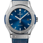 Hublot automatic wristwatch with blue sunburst dial, stainless steel case, and blue leather strap.