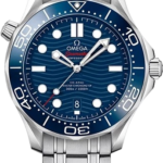 Omega Seamaster Diver 300M watch with blue dial, wave pattern, blue bezel, date window at 6, and stainless steel bracelet.