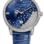 Harry Winston blue-dial luxury watch with diamond-studded bezel and moon-phase display on a blue strap