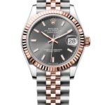 Rolex Datejust watch with gray dial, two-tone rose gold and stainless steel bracelet, fluted rose-gold bezel, date window at 3 o'clock against a black background