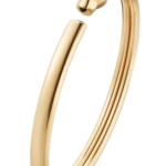 Gold open cuff bracelet featuring a cat head detail at the end