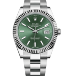 Close-up of a Rolex Datejust stainless steel watch with a green dial, fluted bezel, and date window at 3 o'clock.