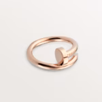 Rose gold open-ring with a curved, double-band design on a light background.