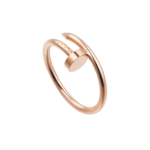 Rose gold intertwined metal rings set against a black background, a close-up product shot