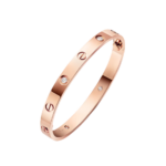 Rose gold Cartier Love bracelet with screw motifs and diamond accents on a dark background