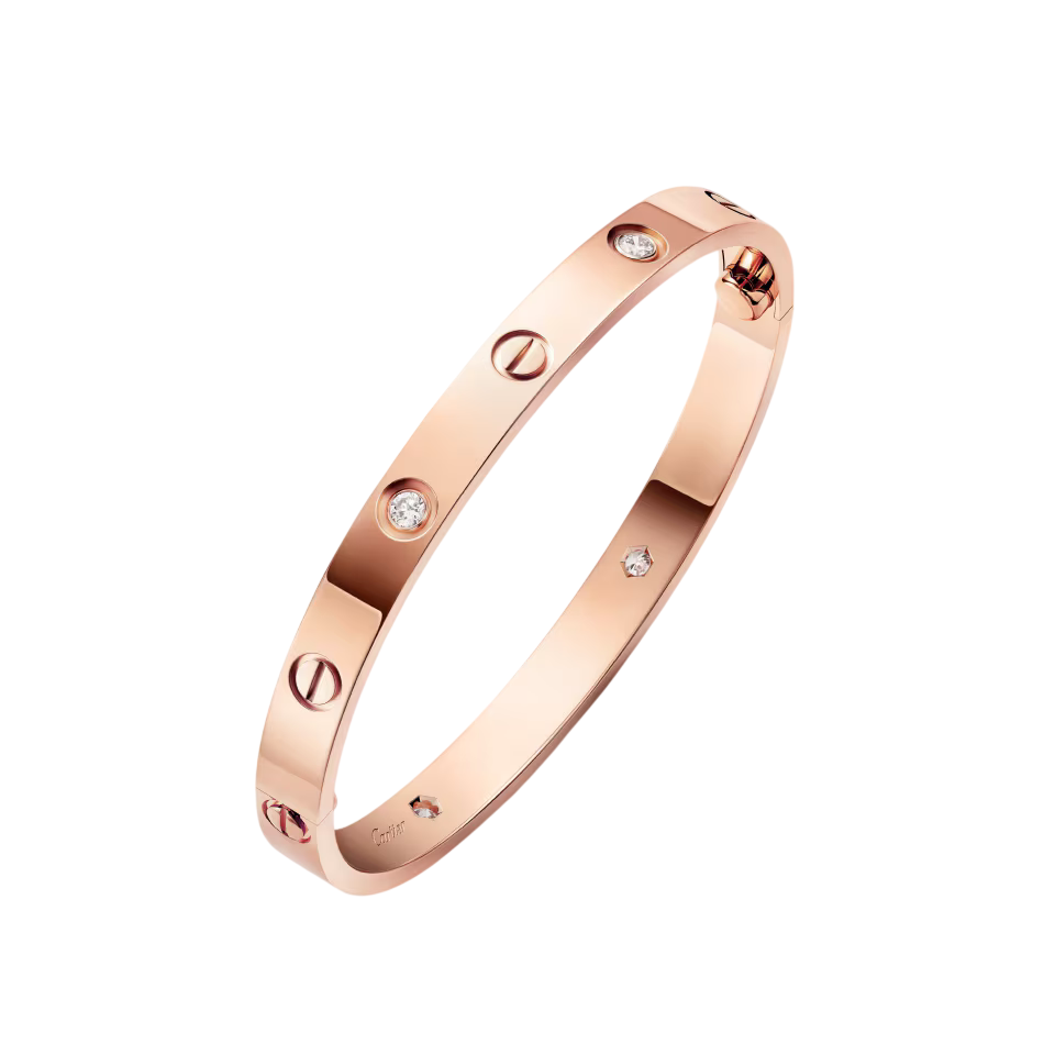 Rose gold Cartier Love bracelet with screw motifs and diamond accents on a dark background