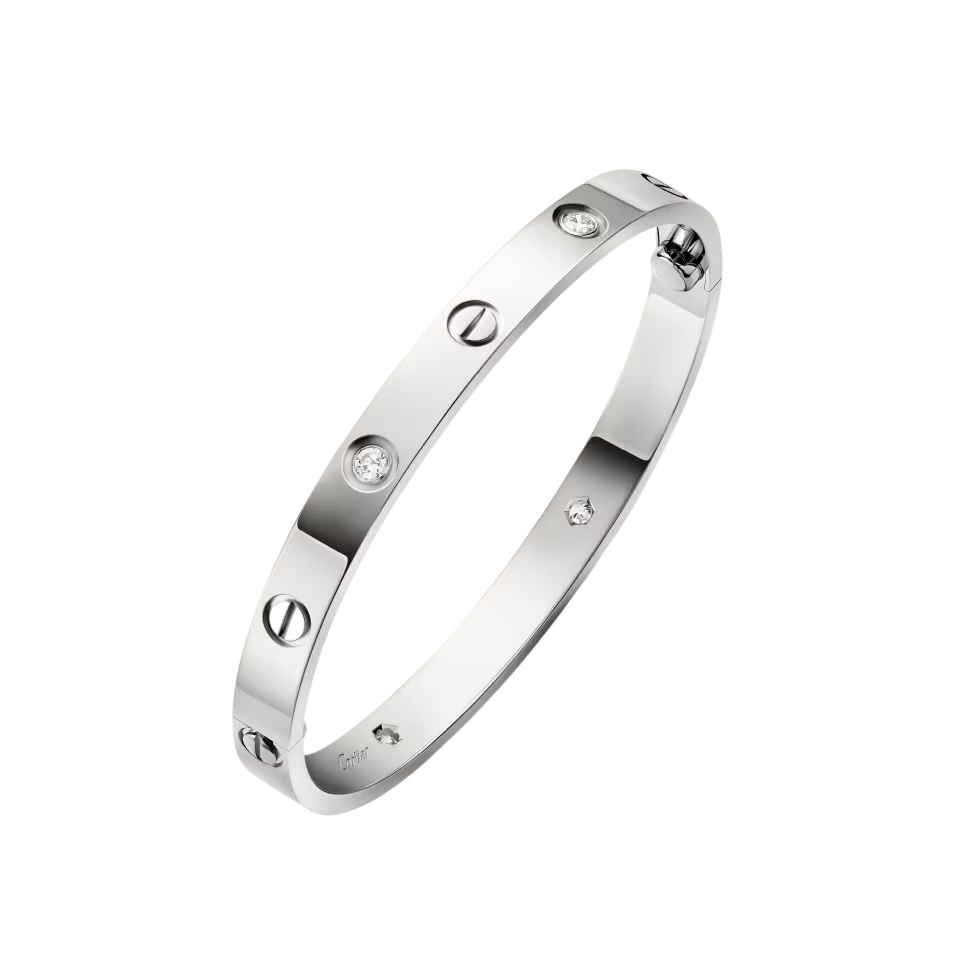 Cartier Love bracelet in polished metal with screw motifs and round diamonds along its surface.