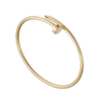 Gold open cuff bracelet with a small clasp, rotated to show the minimalist design.